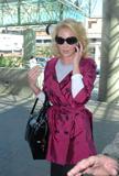 Katherine Heigl flies out of the country with her parents from LAX airport 