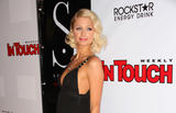 Paris Hilton in black low-cut dress at In Touch Weekly's Summer Stars Party in Los Angeles