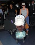 Jamie Pressly with dude and baby arriving in LAX candids
